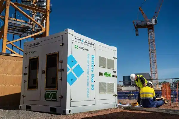battery box energy storage system on construction site with tower crane in the background