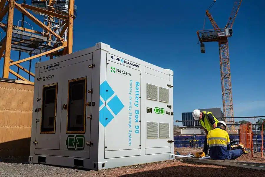 battery box energy storage system on construction site with tower crane in the background